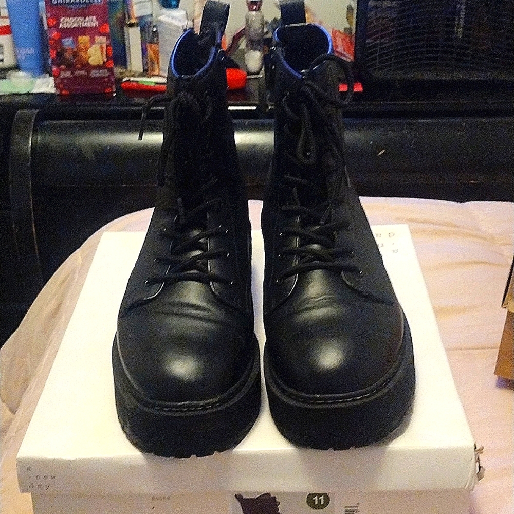 Women black combat boot size 11.